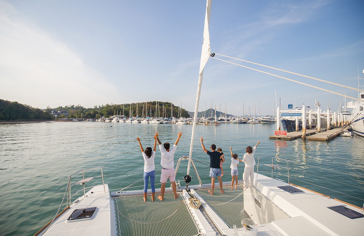 The luxurious 52 feet long catamaran Blue Moon returns to the Ao Po Grand Marina located on the eastern edge of Phuket, Photo - Wan Tse, Simpson Yacht Charter