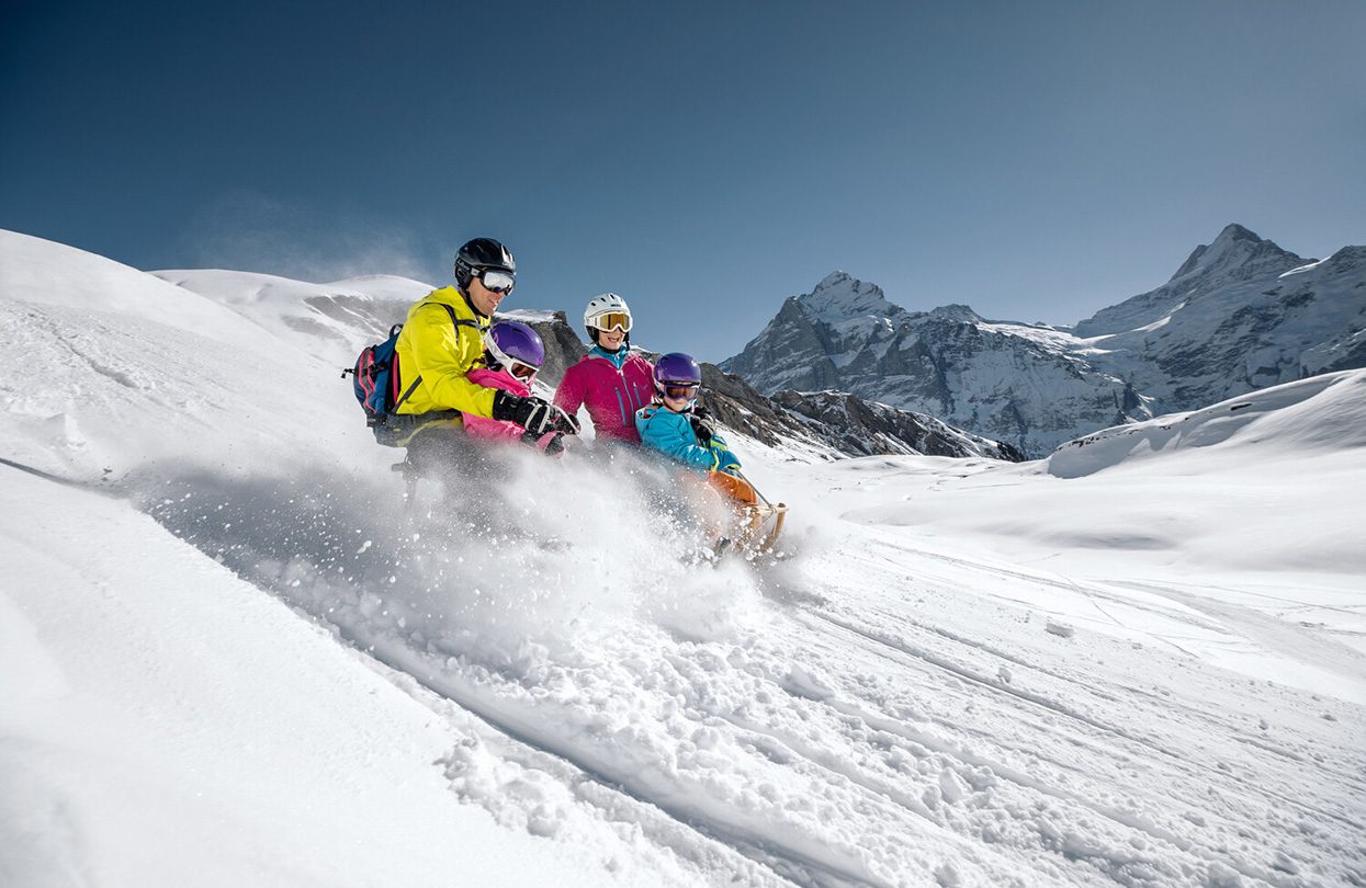 Family fun when tobogganing at Big Pintenfritz, image by Switzerland Tourism